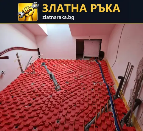 Сиви тръби се извиват върху червена релефна подложка в малко помещение с розови стени